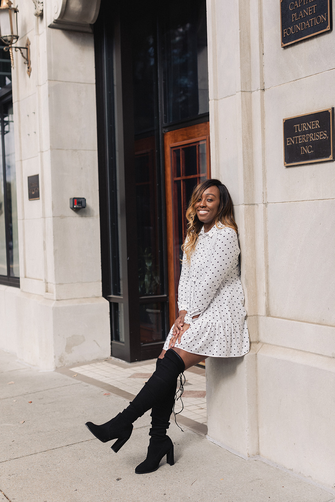 Jordan Taylor C - 6 Free Apps that EVERY Blogger Needs, black woman in white polka dot dress and stuart weitzman over the knee leaning against a wall, apps every blogger, apps every blogger needs, apps every blogger